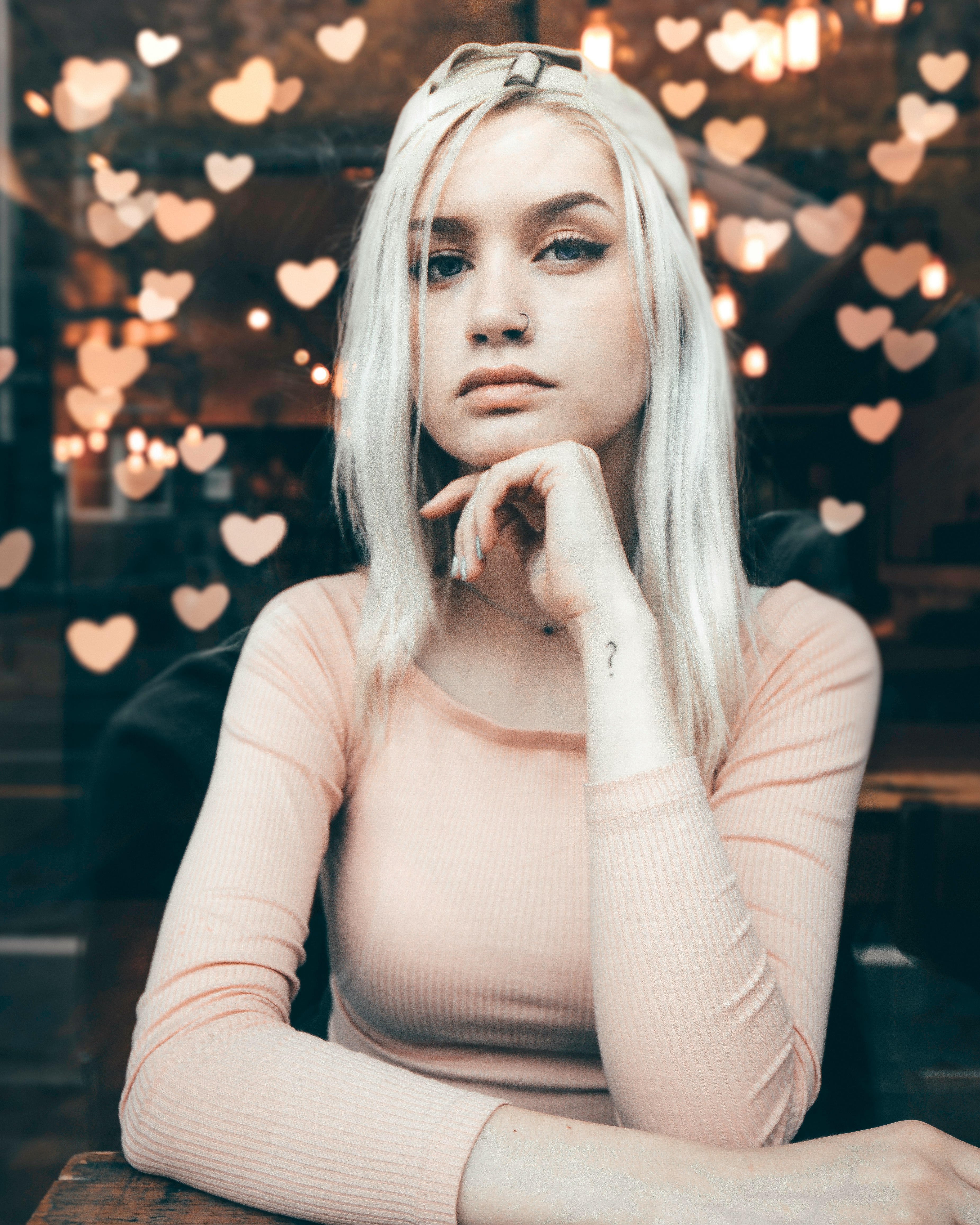 shallow focus photo of woman sitting on chair